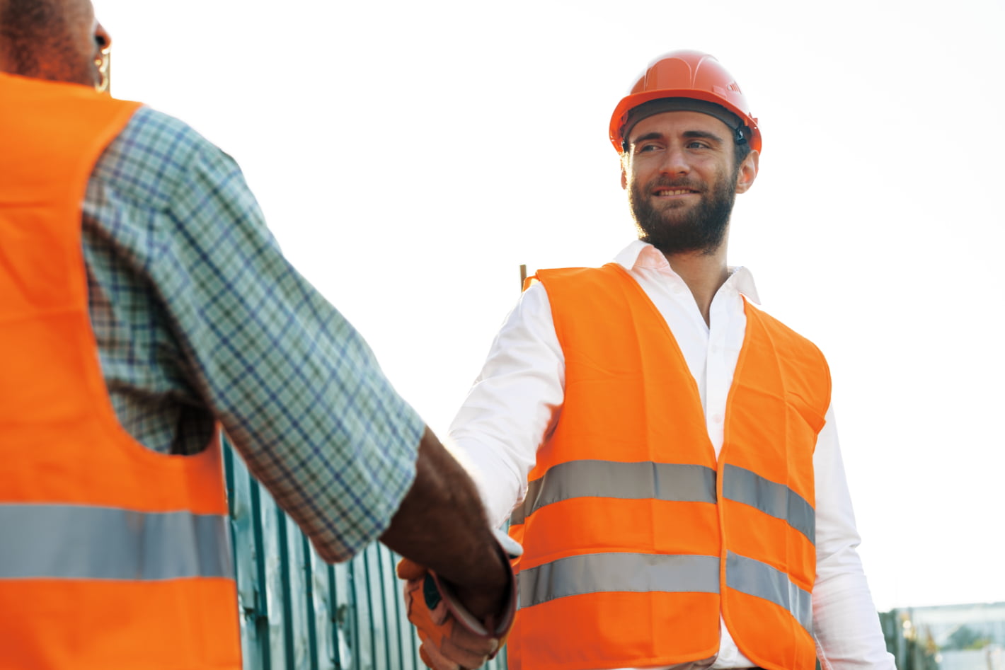 close-up-photo-of-two-men-builders-in-workwear
